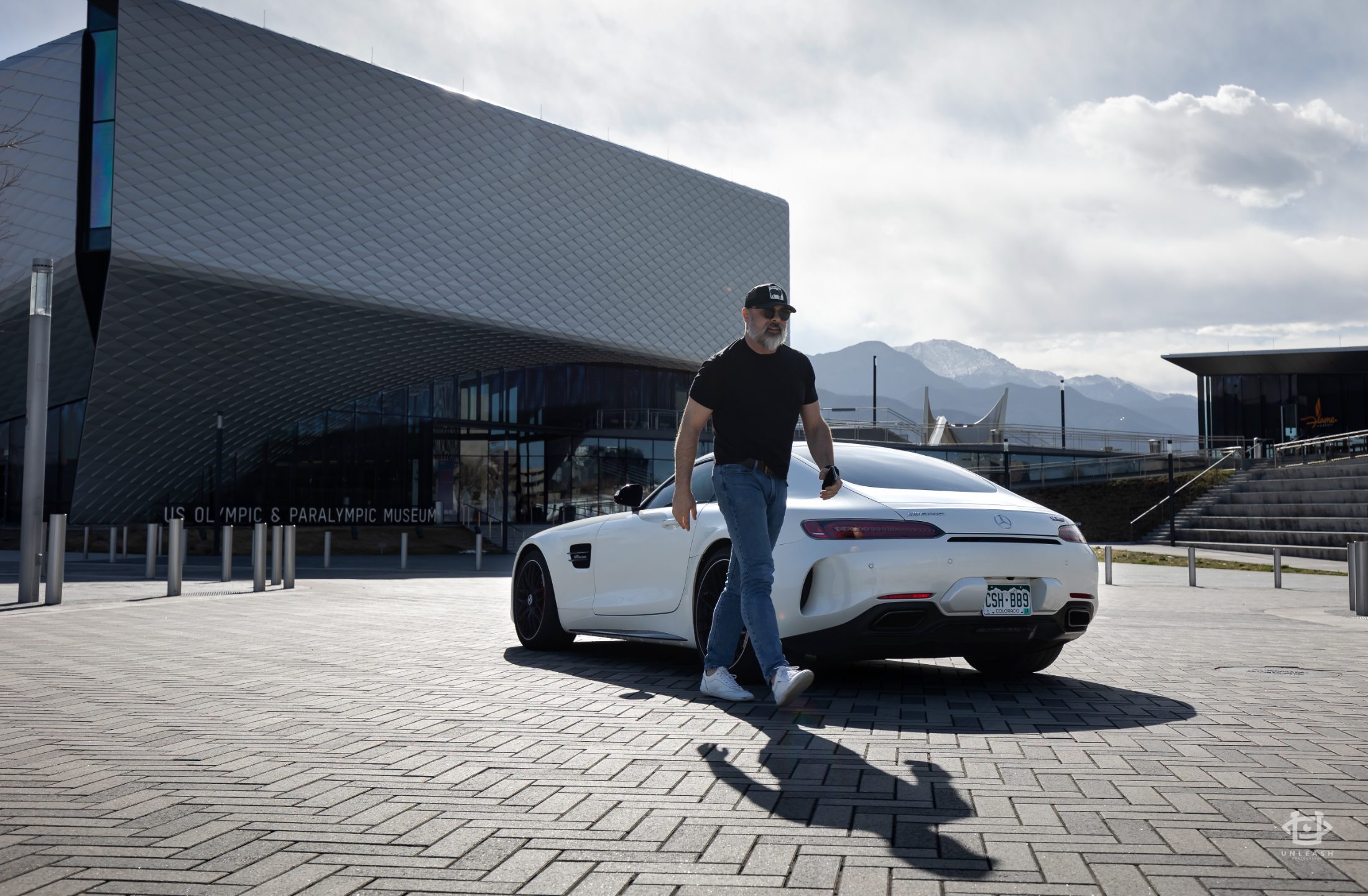 Owner beside an AMG GT